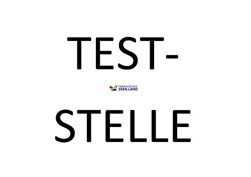 Weißer Hintergund. Große schwarze Schrift: Teststelle